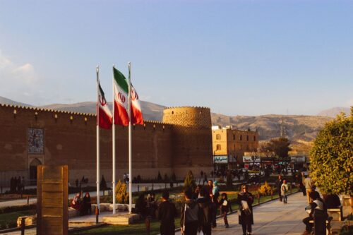 Karim Khan Citadel with Iran flags at sunset, Shiraz, Iran.