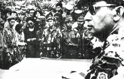 Photo of then-Maj. Gen. Suharto of Indonesia attending funeral of five generals slain in 30 September movement.